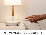 Small photo of Turn off Lamp indoor, Saving Energy concept. Switch off Table Lamp Local Light in Bedroom.