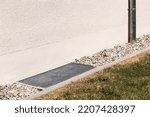 Small photo of Drain System Crushed Stone, Gravel, Drainage Mesh, Gutter Pipe around Perimeter House. Drainage Sewage Floor of Building.