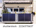 Solar Panel on Balcony of Modern Apartment Building. Modern Balcony with Solar Panels, Marquise and Garden