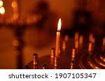 Lighted candle in the Orthodox Church. Christianity. Icon. Religion. Symbol of faith