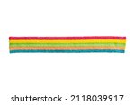 Small photo of marmalade candy in the form of a ribbon of rainbow colors isolated on white background. High quality photo