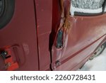 Small photo of Close-up of a mangled car door.
