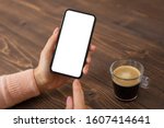 Woman using mobile phone. Smartphone mockup with empty white screen.