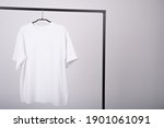 T-shirt on a light background without inscriptions. Clothing made from natural materials, cotton. Women's white tee mockup. High quality photo