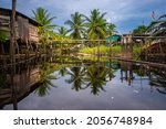 Small photo of Melanau village at Kampug Telian, Mukah Sarawak, Malaysia .Pathway between house to house still using wood bridge or path