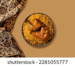 Small photo of Chicken kabsa - homemade arabian rice, Saudi food. The national Saudi Arabian dish chicken kabsa with roasted chicken quarter and almonds