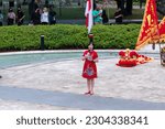 Small photo of Melawai, South Jakarta, Indonesia - January 28, 2023: An emcee wearing a red shirt is opening the China Town Festival at the Christina Martha Tiahahu Literacy Park.