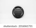 Small photo of A reliable black camera lens cap with a diameter of 52mm, designed to provide good protection for the camera front glass such as from dust, scratches and accidental damage.