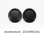 Small photo of Two black camera lens caps with a diameter of 52mm, designed to provide good protection for the camera front glass from dust, scratches and accidental damage.