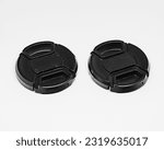 Small photo of Two black camera lens caps with a diameter of 52mm, designed to provide good protection for the camera front glass from dust, scratches and accidental damage.