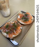 Small photo of Salmon bagel with chopped red onions, copers, dill, and cream cheese