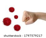 Small photo of Fighting covid 19. Fist. Pandemic. Rebuff. Virus particles.