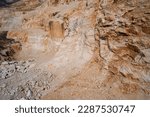 Small photo of Quarry section. Quarry wall in the mountains. Italian marble quarries. Marble quarries. Brown marble quarries.