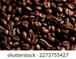 Roasted coffee beans close up background 