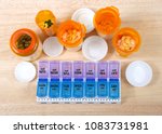 Small photo of Pre-filling twice a day medication box with many pills. The importance of medication management cannot be overstated, especially when it comes to the care of seniors. Med boxes assist with management.