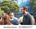 Small photo of San Francisco, CA - Oct 22, 2022: Senator Scott Wiener speaking with participants at his Halloween Pumpkin Carving Event at Noe Courts park.