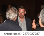 Small photo of Pleasanton, CA - March 1, 2023: Eric Swalwell, representive for California’s 15th congressional district, speaking with constituents at a Town Hall meeting.