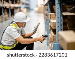 Small photo of Warehouse workers use scanner checking and scan the barcode of stock inventory to keep storage in a system, Smart warehouse management system, Supply chain and logistic network technology concept.