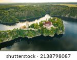 Panoramic view of Zvikov Castle on the hill with trees surrounded by river Vltava and Otava in South Bohemia region in Czech Republic. Pine or spruce forest on the background 