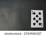 Small photo of ogan ilir,Indonesia-july 22th,2023:eight of spade. rummy isolate on black background. selective Focus image