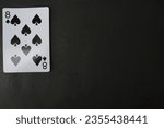 Small photo of ogan ilir,Indonesia-july 22th,2023: eight of spade. rummy isolate on black background. selective Focus image