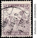 Small photo of Hungary, circa 1919: stamp depicting two farmers.