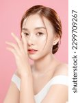 Small photo of Young Asian beauty woman pulled back hair with korean makeup style touch her face and perfect skin on isolated pink background. Facial treatment, Cosmetology, plastic surgery.