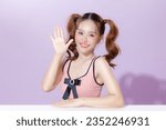 Small photo of Young Asian beauty woman model pigtail hairstyle with cute makeup on face and perfect clean skin on isolated purple background. Facial treatment, Cosmetology, Aesthetic, plastic surgery.
