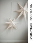 Paper Stars Hang Against The...
