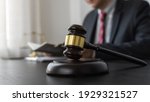 Small photo of Professional lawyer considering with contract papers in courtroom. Justice, Law, Attorney and Court judge concept.