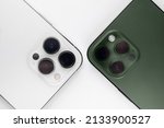 two smartphones on a white background Alpine Green. 
iphone 13 pro max alpine Green 