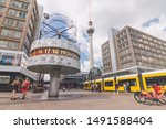 Small photo of Berlin / Germany - July 2019: Tourists exploring the Urania World Clock in Berlin. Since its erection in 1969, it has become a tourist attraction and meeting place.