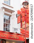 Small photo of London, UK - February 1 2022: The Gerrard Street sign in Chinatown, London when the streets are decorated with Chinese red lanterns for Chinese New Year
