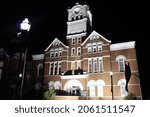 Small photo of McDonough City Hall lit up at night