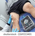 Small photo of Electromyography EMG and Somatosensory Evoked Potential PEV of lower extremities, neurophysiological test applies electrical stimuli near the nerves to explore the rectus femoris muscle