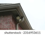 Small photo of Gutter system and downspout allows good drainage