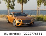 Small photo of DUBAI ,UAE - 05112022: Bentley Continental GT Gold exterior, luxury car, exotic car, super car.