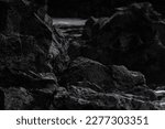 Very big and beautiful black rocks the power of the ocean black lave stone close up dark rocks wet