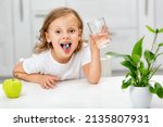 Small photo of child with a pill dragee on her tongue. Taking medicine, vitamin supplements, health care, treatment concept. Full multivitamin formula with minerals