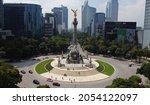 Small photo of Mexico City, Mexico - October 7, 2021: Aerial view of the iconic monument Angel of Independence, after the finish of a long restoration work, located in Paseo de la Reforma avenue.