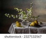 Still life with branches of cherry blossoms and pears on a dark background.