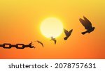 Small photo of Concept of Freedom with chains breaking and turning into a free dove that flies away at sunset. Liberty Concept