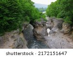 Small photo of Stunning landscape in the Khadzhokh gorge. The narrow part of the gorge and the Belaya River. Kamennomostsky canyon. Bubbling mountain river Belaya. Adygea.