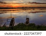 Small photo of Two fishing boat in the angono lake rizal with beautiful sky sunset sunrise repletion.