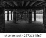 Small photo of UNDERNEATH A PIER ON LUMMI ISLAND WITH A CALM PUGET SUND ANDA SLIGHT FOG ROLLING IN IN WASHINGTON STATE