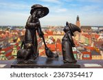 Wroclaw gnomes. Witches Tekla and Martynka (aka Czarownice Tekla i Martynka) on the Penitents Bridge (aka Mostek Pokutnic) between towers of St. Mary Magdalene