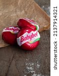 Small photo of babybel cheese snack on rustic background Billere,Aquitaine,France 03-22-22