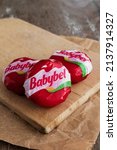 Small photo of babybel cheese snack on rustic background Billere,Aquitaine,France 03-22-22