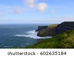 Small photo of Rollicking waves at the base of the Cliff's of Moher in Ireland.
