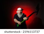 Small photo of a man with a beard brandishes a shovel on a red background